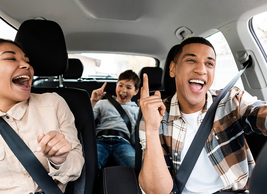 Personal Insurance - Cheerful Family Enjoying a Family Car Ride